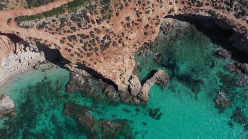 Aerial view of coastline and turquoise water, Malta.