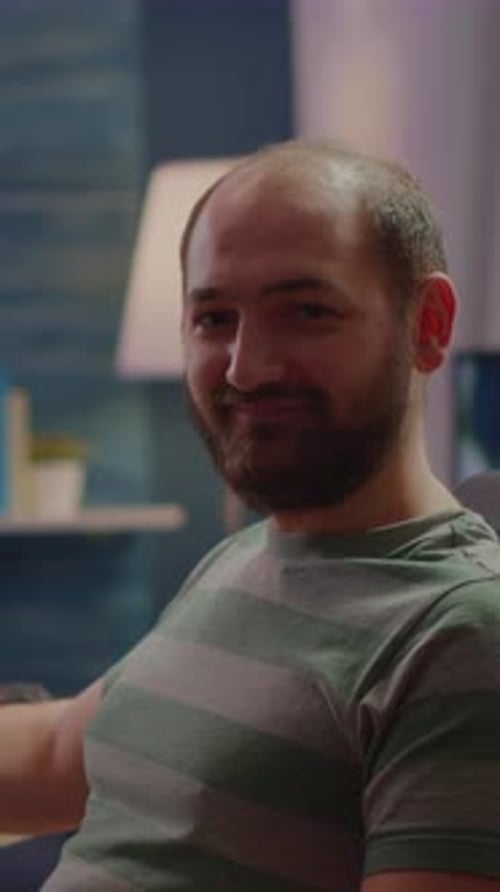 Man Smiling in Striped T-Shirt