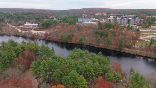 A Stunning Aerial View of the Autumn Landscape with a River and Colorful Foliage