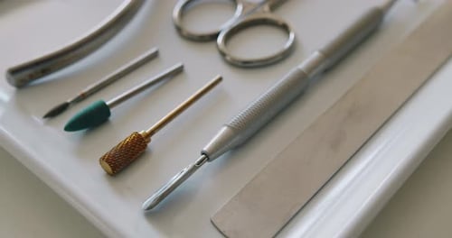 Manicure Tools Arranged on a White Tray