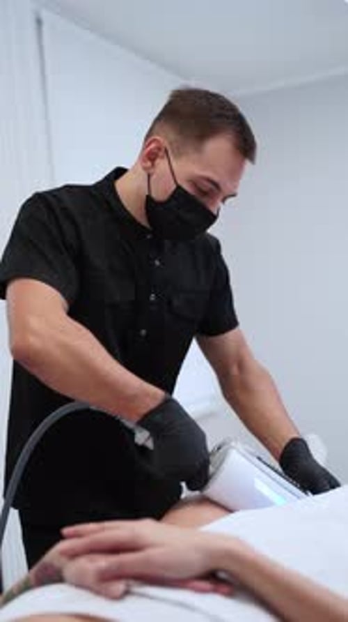 Medical Professional Performing Clinic Procedure on Patient