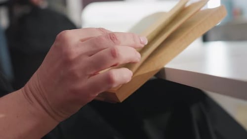 Woman Reading an Old Book Indoors Daytime Close-up