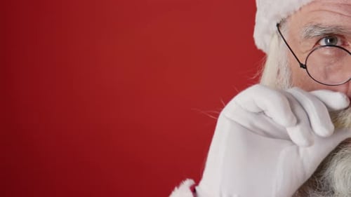 Santa Claus Stroking White Beard Close Up