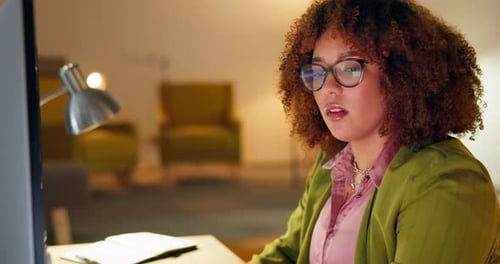 Worker, serious or planning on computer in night office for website coding