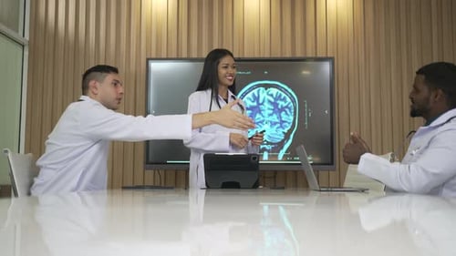 Doctors Discuss Brain Scan in Meeting, Shake Hands