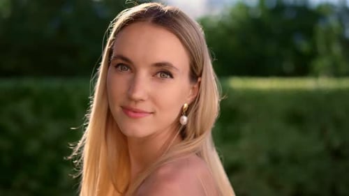 Smiling Woman with Blonde Hair Posing Outdoors