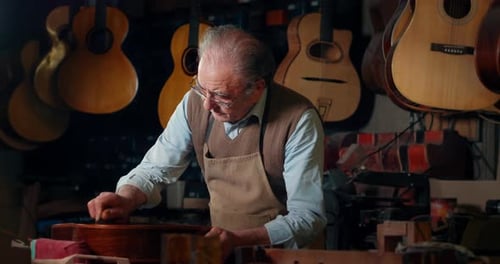 Luthier Sands Guitar in Warmly Lit Workshop