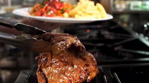 Preparing roast beef in restaurant, close-up, Mediterranean