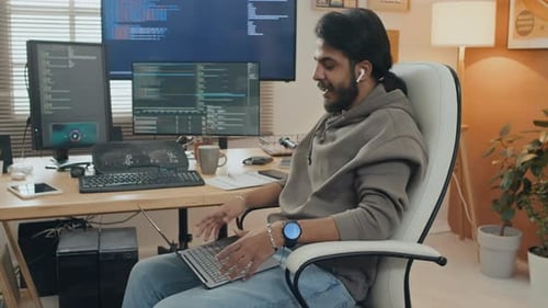 Man Talking During Video Call at Desk