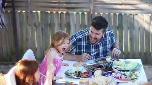 Father and Children Enjoy Backyard Barbecue