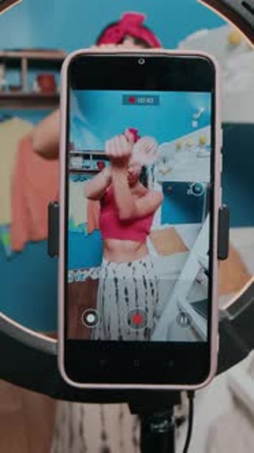 Young Woman Records Fashion and Beauty Video