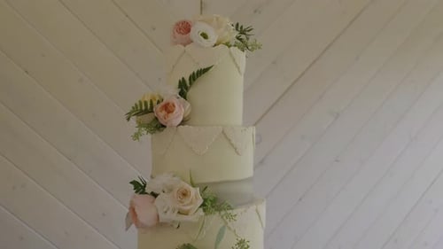 Elegant Wedding Cake with White Frosting and Flowers