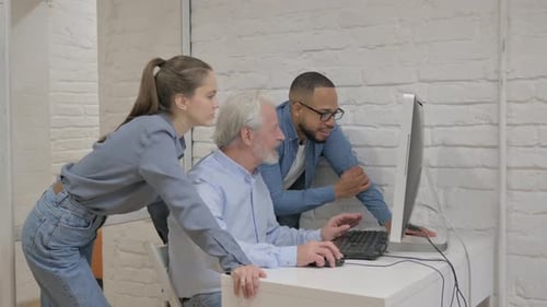 Mixed Race People Working on Computer in Office