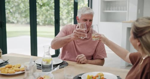 Cheers, drinks and senior man with family at lunch or dinner in home on holiday