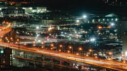 Timelapse of a busy highway in downtown Toronto at night. Slow zoom out reveal.