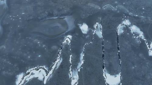 From above, a large body of water freezes in winter, and the ice will form beautiful patterns.