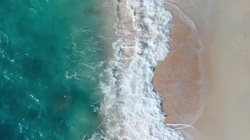 Ocean Waves Roll Onto Sandy Shore Tropicals Nature Aerial View Beauty of Ocean Shore Pristine Sands