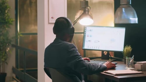 Employee Enjoying Music Bopping Head