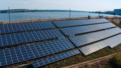 Solar Panels Generating Clean Energy by Lake