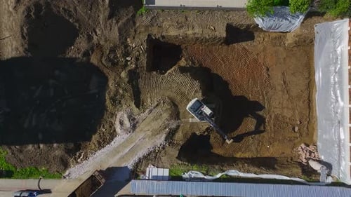 Aerial Video of Excavator Digging Ground for New Building