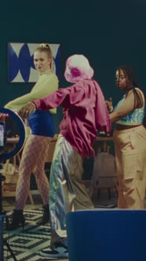 Three Young Adults Dancing in Fashionable Styles