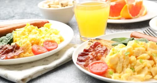 Delicious Breakfast Plate with Bacon, Eggs, and Sausage