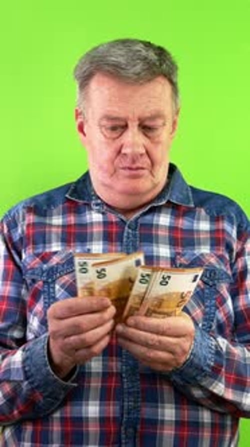 Senior Man Counting Cash of 50 Euro Money Banknotes and Smiling Pleased
