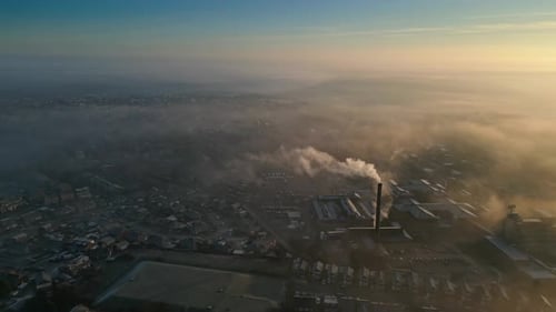 Aerial View of Cityscape Obscured by Fog and Smoke