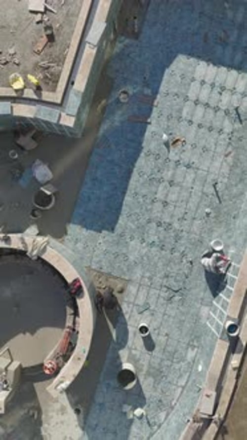 Construction Workers Laying Patio Tiles Aerial Birds Eye View