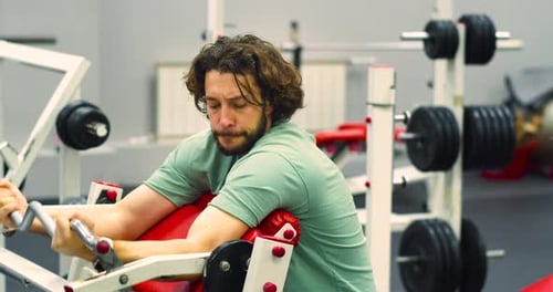 Gym Workout Bicep Exercise Young Caucasian Man Trains His Bicep Muscles in the Gym