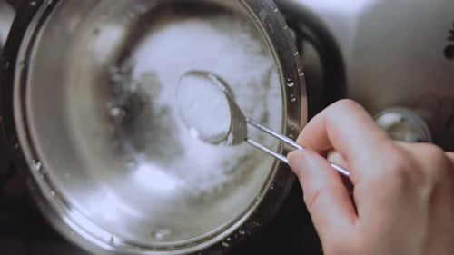 Caramel Boiling Process Mix with a Spoon Macro