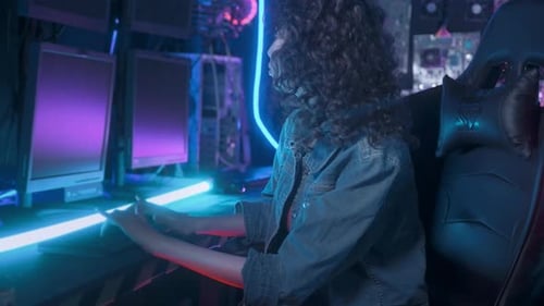 an asian woman programmer is working in her computer room