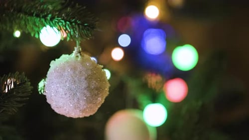 Christmas Ornaments on a Christmas Tree at Night