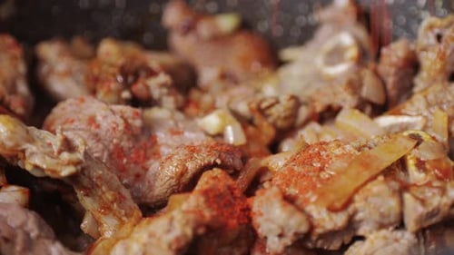 Chicken or Pork Stew with Red and Green Pepper Onion and Spices Cooking in a Frying Pan Traditional