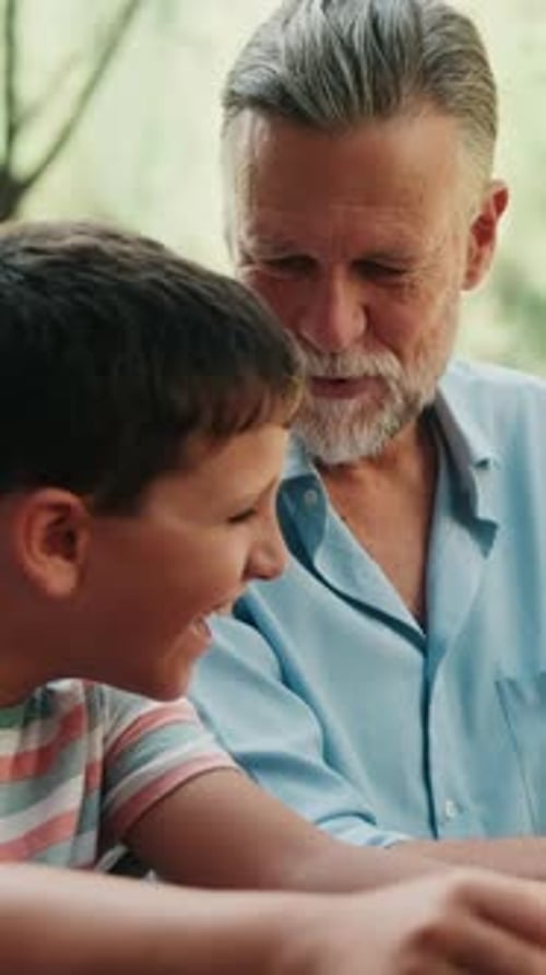 Boy and Man Chatting Outside