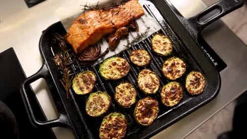 chef prepares a salmon dish in the kitchen. Close-up shots