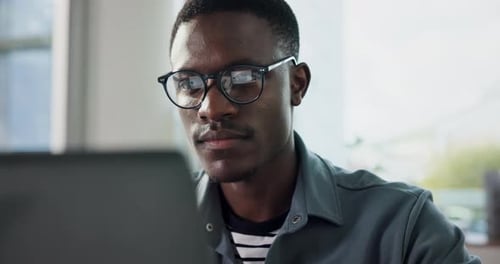 Thinking, programmer and black man with laptop in office, planning or idea for software development