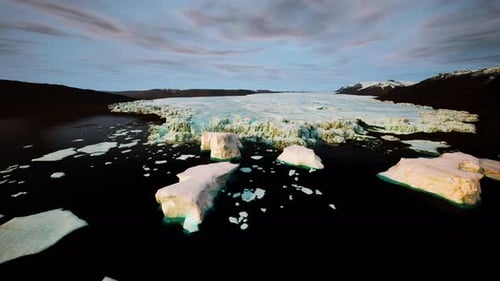 Aerial View of Floating Icebergs and Melting Glacier