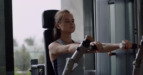 Woman Taking Weight Lifting in Sport Club Female Hands Taking Bodybuilding Dumbbells in Gym Club