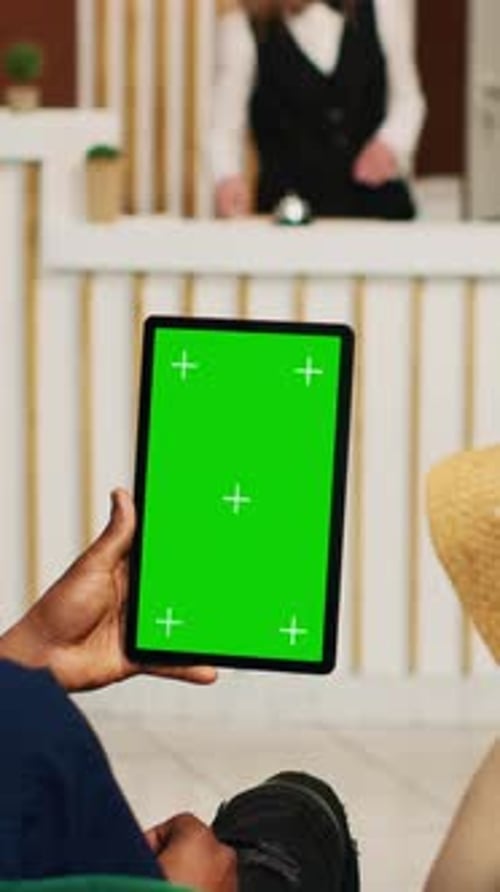 Vertical Video Guests Holding Tablet with Greenscreen