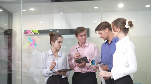 Business people, conversation and brainstorming on glass in office for agenda and surprise by ideas.