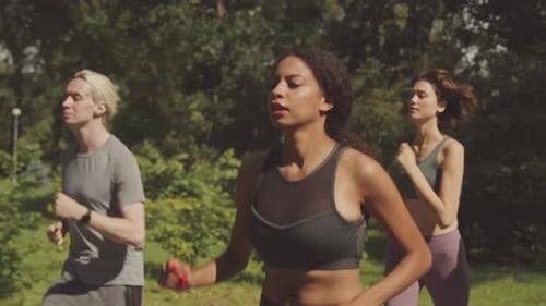 Young Athletes Jogging in Park