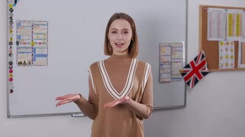 Woman Teaching in Classroom with Whiteboard