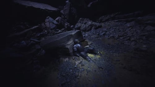 Person in Dark Cave with Scanning Flashlight Beam