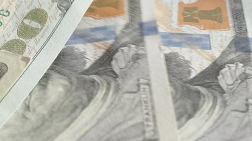 Counting One Hundred Dollar Bills, with Twenties Mixed in Between. Close-Up.