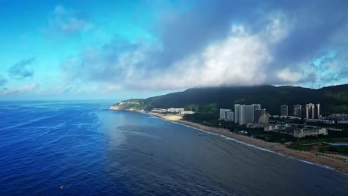 Aerial Top view of a transparent blue sea with beautiful waves at sunny day in summer. air of ocean