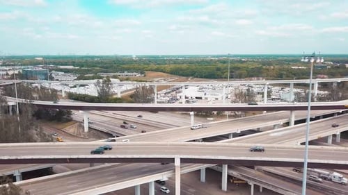 Aerial Overlook of Busy Highway Interchanges and Sprawling Urban Landscapes