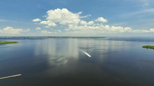 White Speedboat Swimming Fast on Bay Waves with Ripple Surface Motor Boat in Motion on Ocean at High