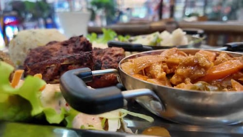 Delicious Platter Featuring a Mix of Savory Dishes at a Food Market