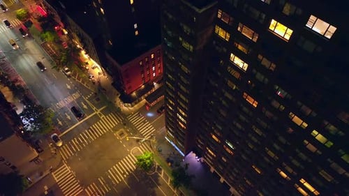 Busy New York roads at night. Lively streets of vibrant metropolis from aerial perspective.